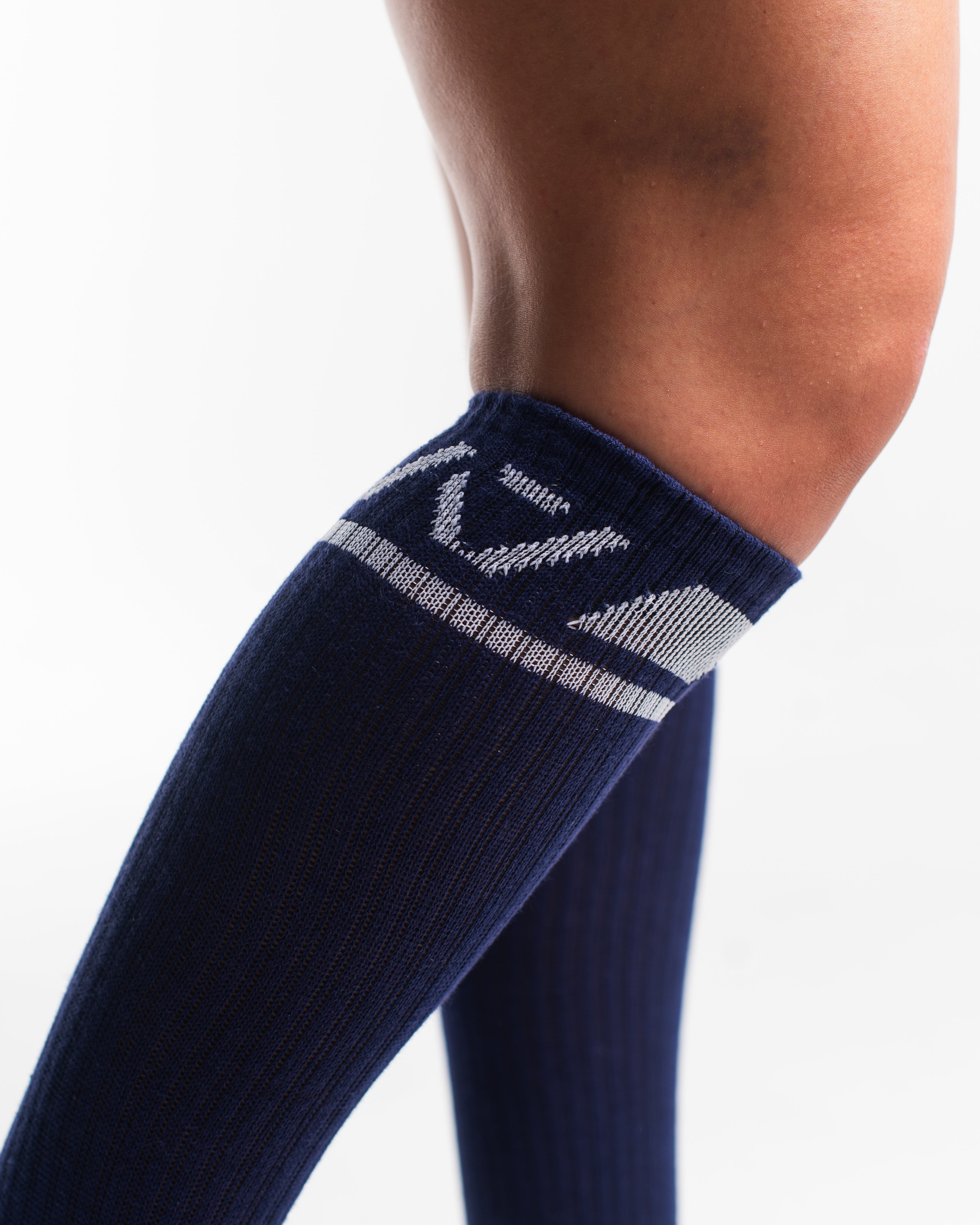 Close-up of the knit fabric on A7 Deadlift Socks in Night Light, showing texture and stitching details.
