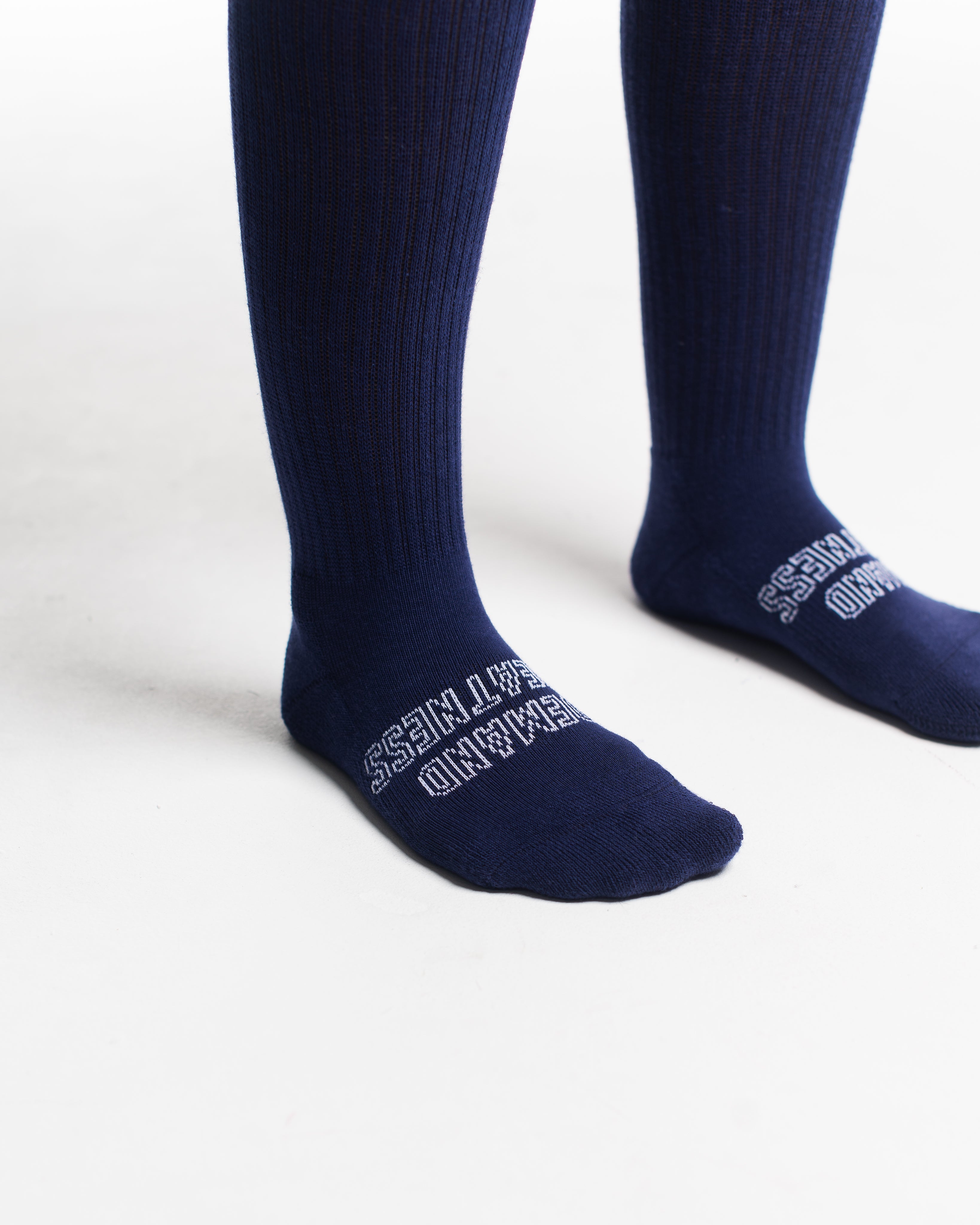 Close-up of the knit fabric on A7 Deadlift Socks in Night Light, showing texture and stitching details.