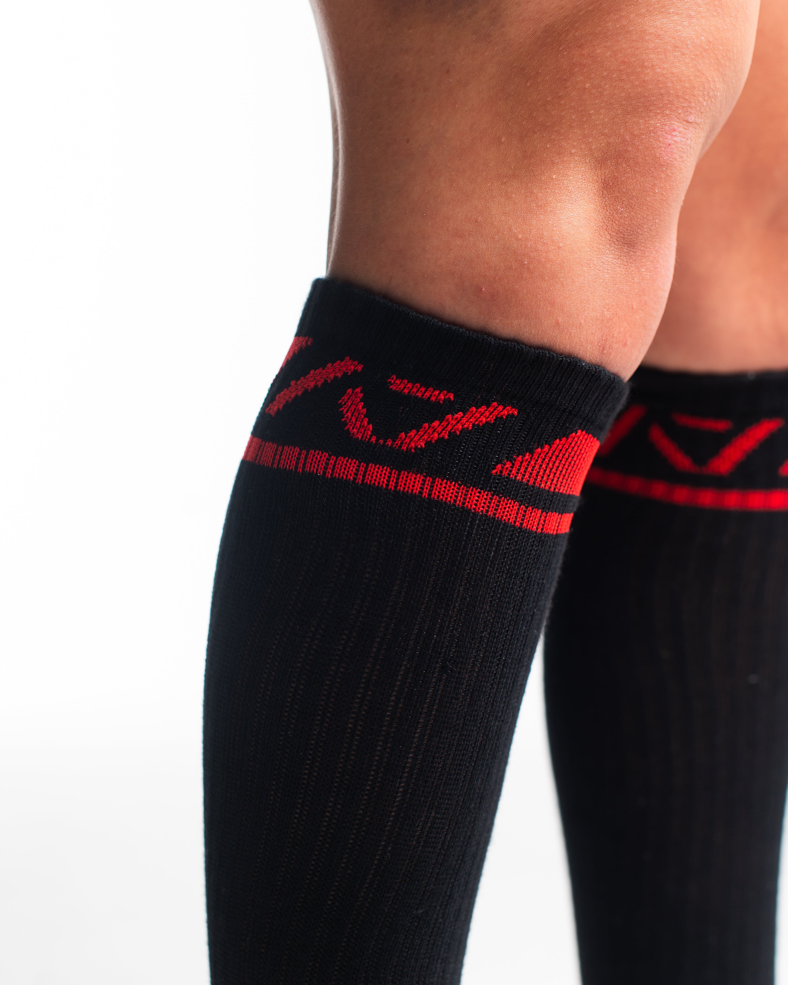 Close-up of knit texture on Red Dawn deadlift socks, emphasizing sturdy fabric and smooth stitching.