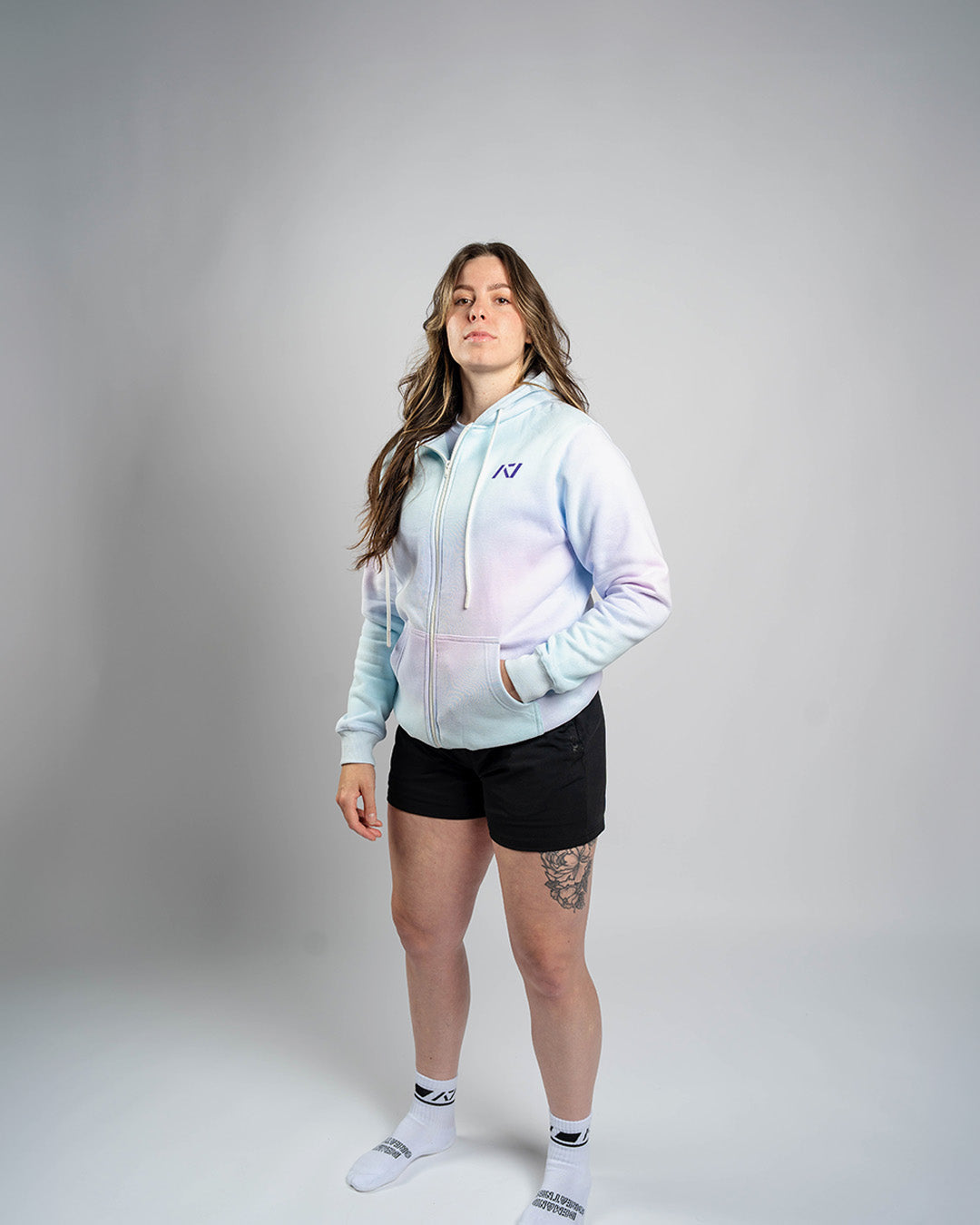 Athlete wearing the A7 Affirmation Zip Hoodie – Pastel demonstrating fit and style in a gym setting.