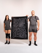 A7 Built By Banner hanging on a gym wall, showcasing its size and motivational design.