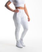 Front view of Polar Defy Joggers showing mid-rise waist, tapered legs, and zippered front pockets.

