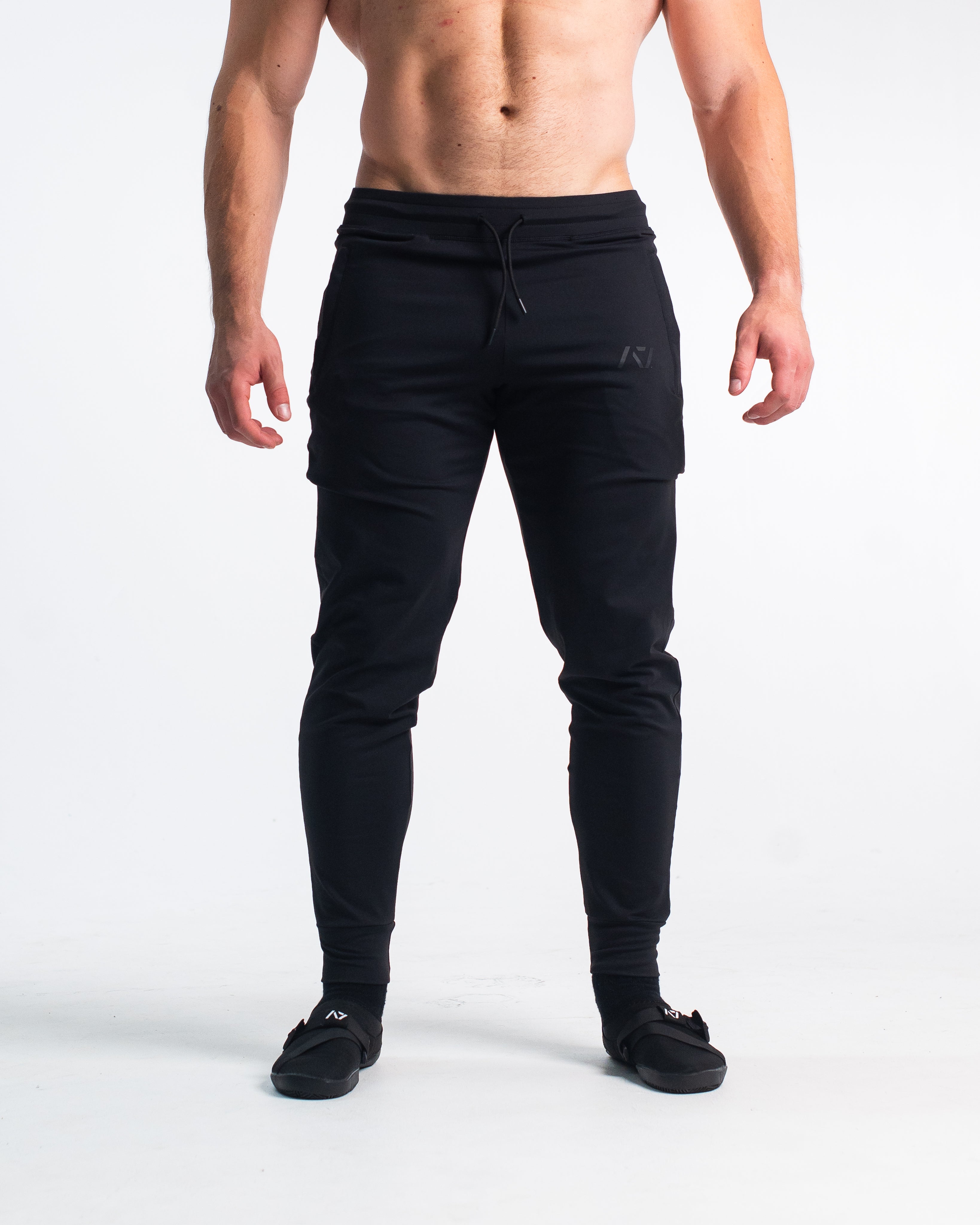 front.jpg	Front view of Stealth Defy Joggers showing tapered leg, mid-rise waist, and zippered front pockets.
