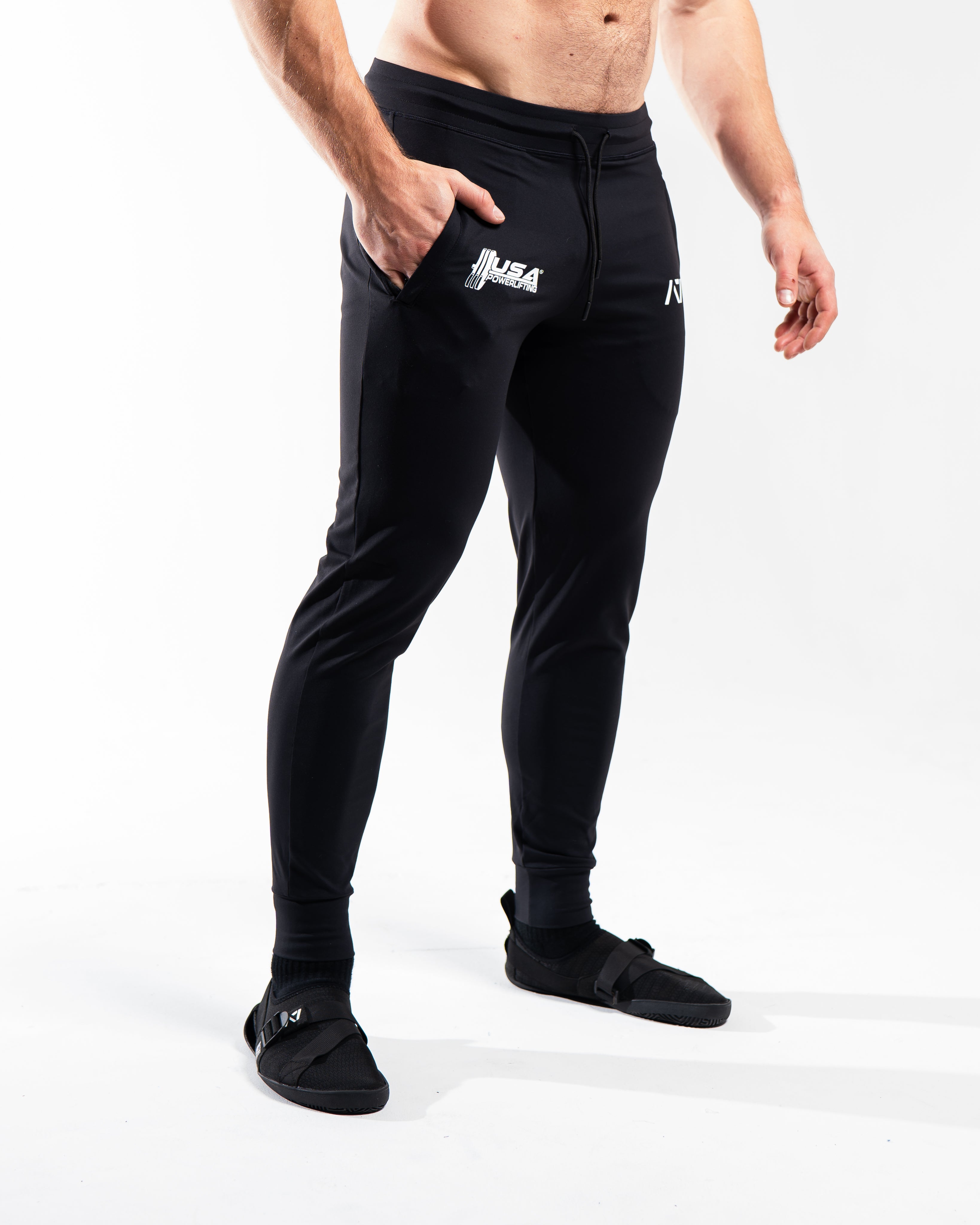 Side profile of the USAPL Classic joggers highlighting the tapered leg and silicone logo print.