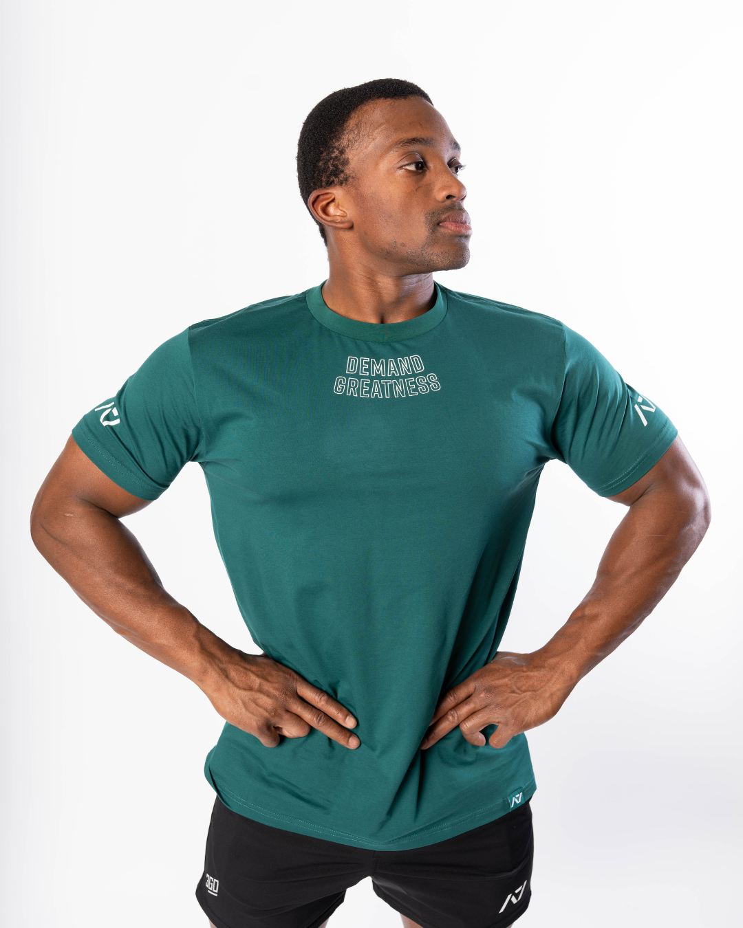 Front view of the Emerald Forás True‑Fit Meet Shirt showing “Demand Greatness” chest print and trimmed fit.