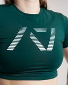 Green crop top with a white geometric design on a neutral background