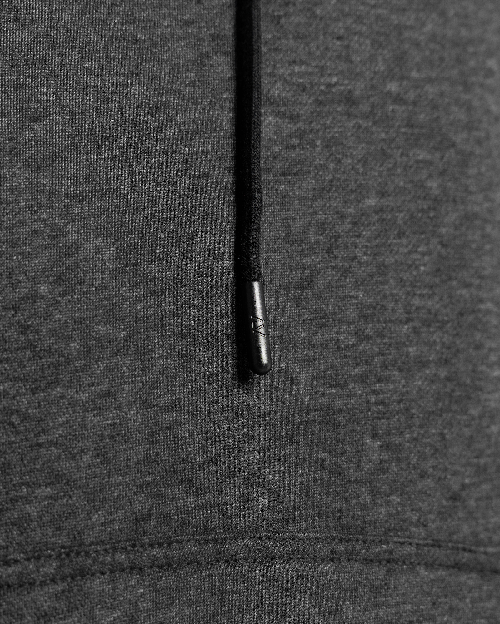 Close-up of a dark gray hoodie draw string