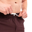 Wide waistband with A7-branded drawstrings on Mahogany 360Go Shorts for a comfortable, no-slip fit.
