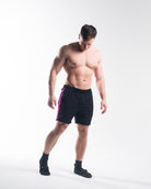 Full body image of athlete wearing A7 360Go Regular Shorts in Flamingo, highlighting color, fit, and performance use.