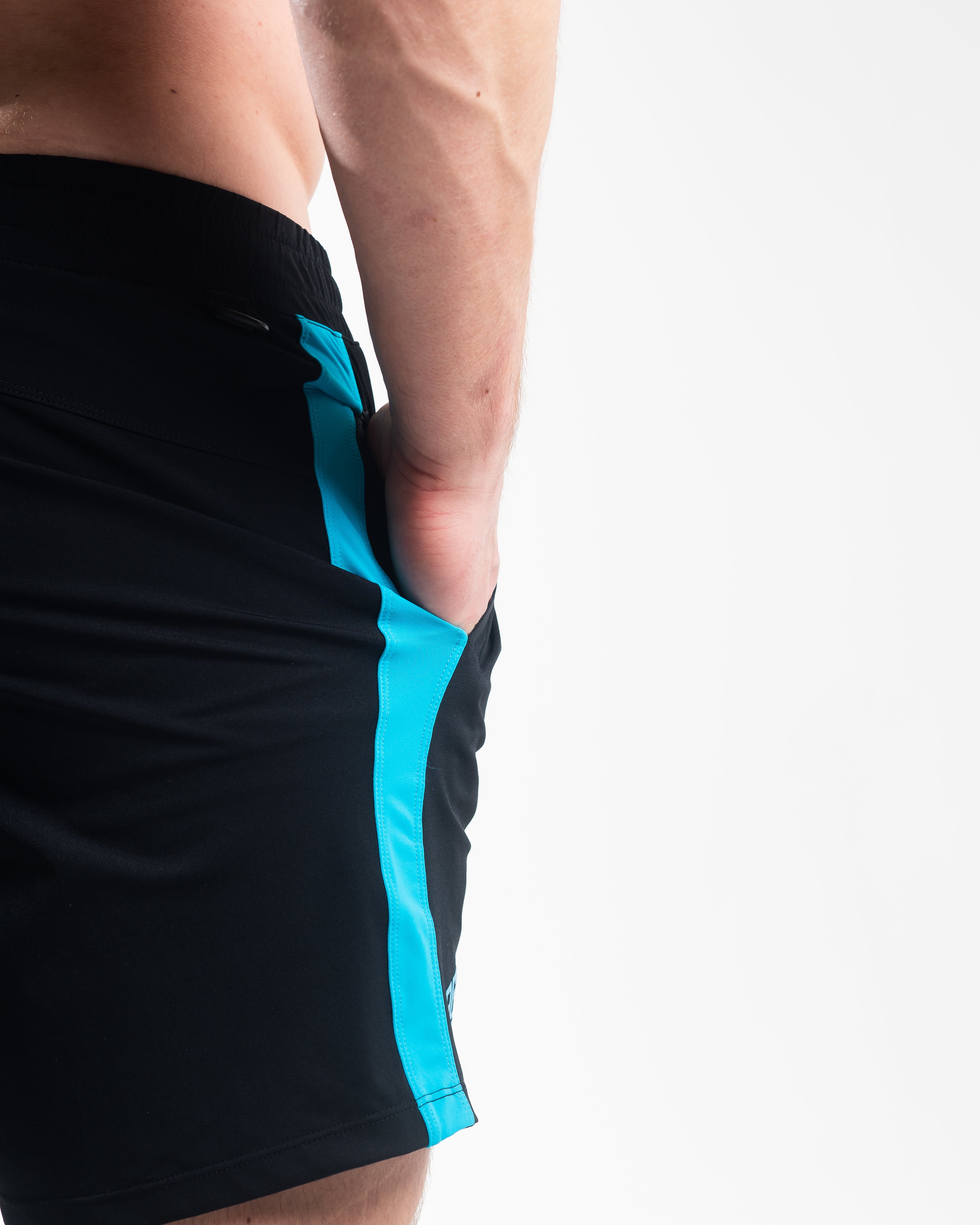 Close-up of ripstop nylon pocket and hidden mini wallet pocket on Azul 360Go Shorts for secure storage.