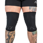 Close-up of A7 Stealth Stiff CONE Knee Sleeves, displaying double-stitched seams and 7mm neoprene thickness.