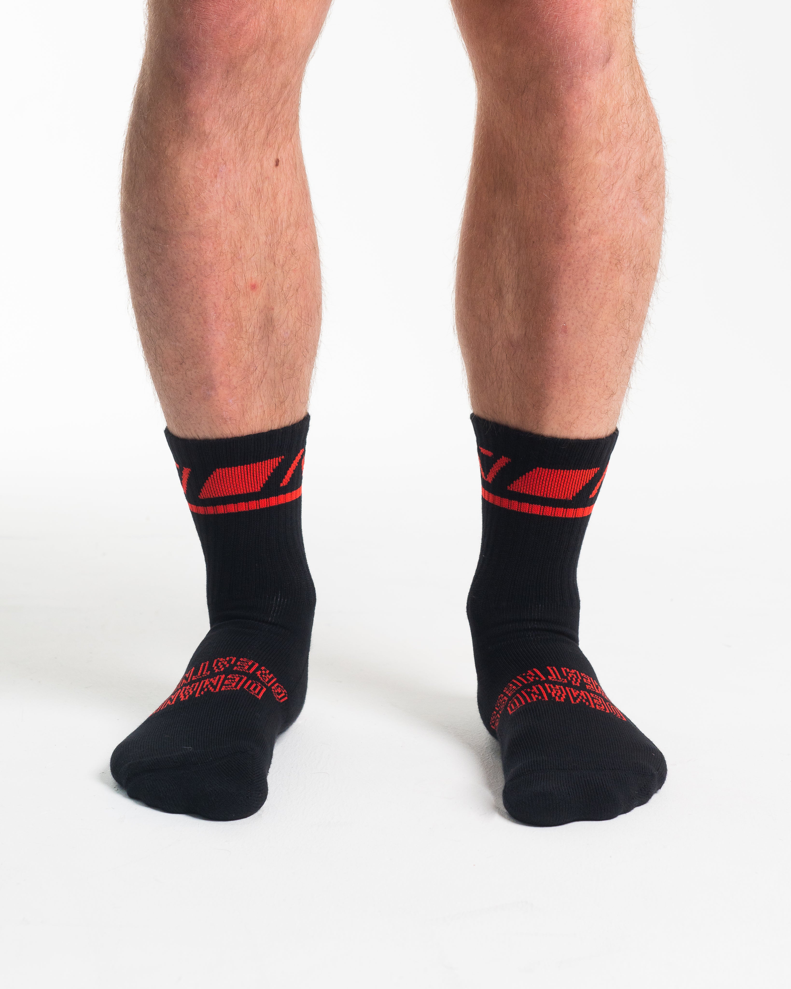 Front view of A7 Crew Socks in Red Dawn, showcasing mid-shin length and ribbed cuff design.