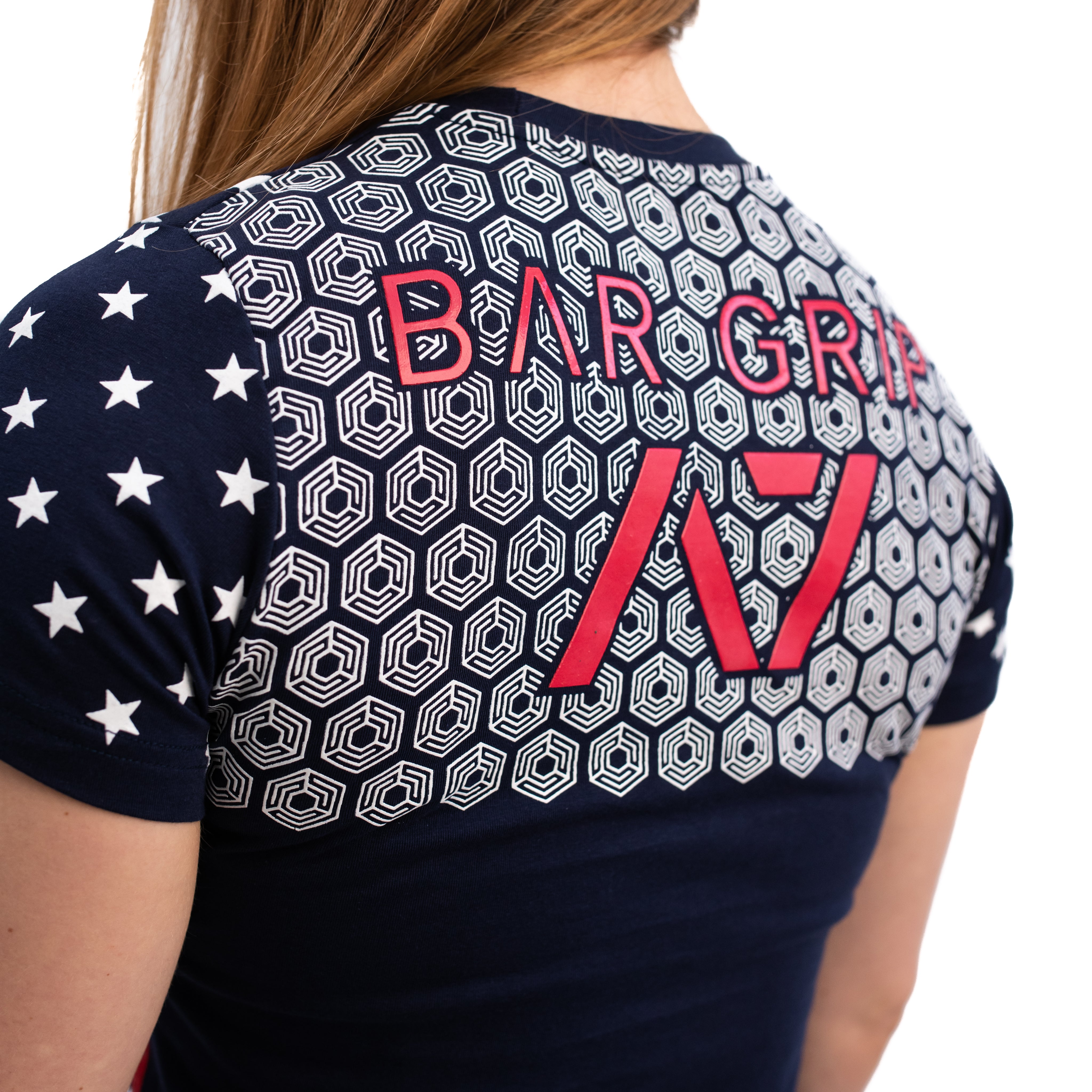 Close-up of the Bar Grip design on the back of the Americana Strongman Women's Shirt, featuring a patriotic grip pattern engineered for stone lifts, yoke carries, and log presses.